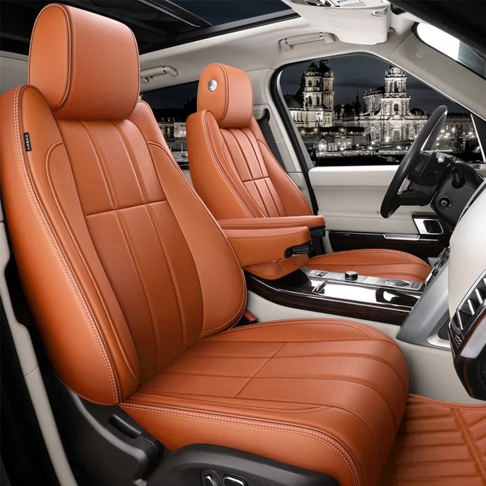 luxury car interior with saddle brown leather seats and night cityscape view through window