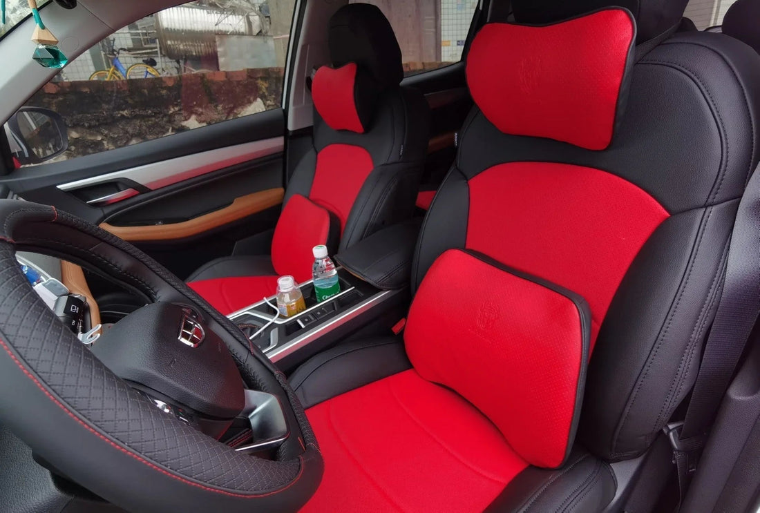 Car interior with black and red ergonomic seat covers and lumbar support cushions