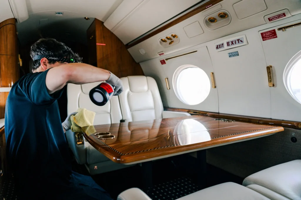 Interior aircraft detailing cleaning luxury private jet cabin table